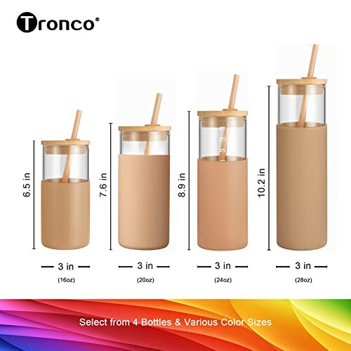 Tronco glass water bottles in four sizes with bamboo lids and straws.